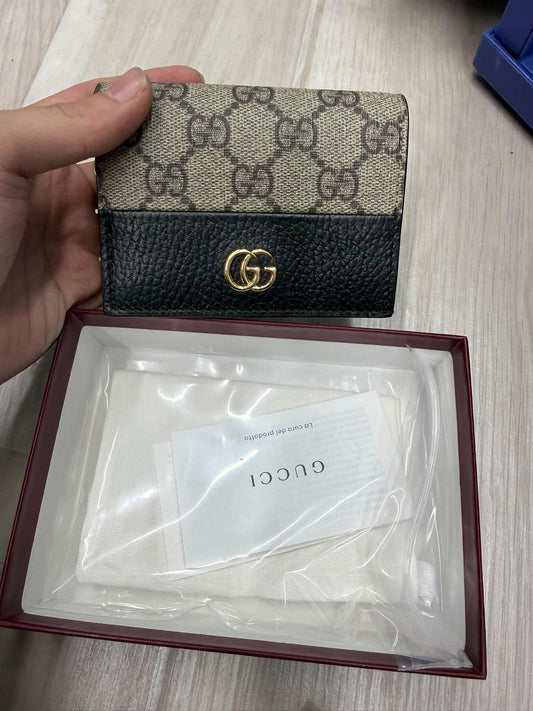your Gucci wallet